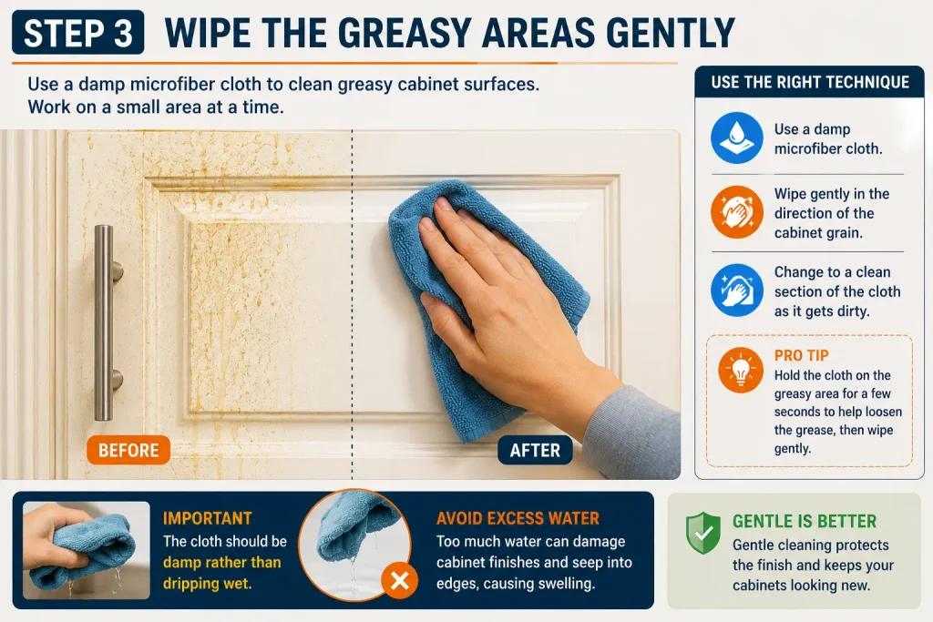 wipe grease from kitchen cabinets with a damp microfiber cloth